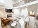 Cozy living room features built-ins, fireplace, and ample seating for entertaining at 3180 Lee Dr, Buford, GA 30518