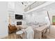 Cozy living room with a fireplace, built-in shelving, comfortable seating and access to an upstairs balcony at 3180 Lee Dr, Buford, GA 30518