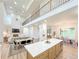 The floor plan includes a cozy fireplace, dining area, and a modern kitchen with a large island at 3180 Lee Dr, Buford, GA 30518