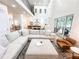 Spacious living room with vaulted ceiling and open access to chef's kitchen and deck at 3180 Lee Dr, Buford, GA 30518