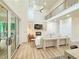 Spacious living room featuring a soaring ceilings, a fireplace, and access to the deck at 3180 Lee Dr, Buford, GA 30518