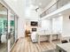 Open-concept living room boasting a fireplace, built-in shelving, and soaring ceilings at 3180 Lee Dr, Buford, GA 30518