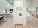 Open-concept living spaces featuring a built-in cabinet, living room with fireplace, and staircase at 3180 Lee Dr, Buford, GA 30518