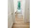 Bright mudroom featuring a built-in bench, wood floors, and access to the outdoor deck at 3180 Lee Dr, Buford, GA 30518