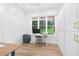 Bright home office with a large window, built-in storage and functional workspace at 3180 Lee Dr, Buford, GA 30518