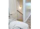 Stairwell featuring natural lighting and a hardwood handrail at 3180 Lee Dr, Buford, GA 30518