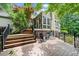 Expansive wooden deck with stairs and black railings, perfect for outdoor entertaining and relaxation at 8170 Hurakan Creek Xing, Cumming, GA 30028