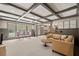 Spacious basement area with coffered ceilings, ample seating, and large windows at 8170 Hurakan Creek Xing, Cumming, GA 30028
