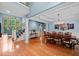 Formal dining room with chandelier, hardwood floors, and wainscoting at 8170 Hurakan Creek Xing, Cumming, GA 30028