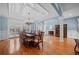 Formal dining room with chandelier, hardwood floors, and wainscoting at 8170 Hurakan Creek Xing, Cumming, GA 30028