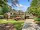 Charming two-story home with stone accents, three-car garage and well-manicured landscaping at 8170 Hurakan Creek Xing, Cumming, GA 30028