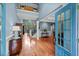 A grand two-story foyer with hardwood floors, a staircase, and natural light at 8170 Hurakan Creek Xing, Cumming, GA 30028