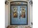 Elegant blue double front doors adorned with wreaths and decorative hardware at 8170 Hurakan Creek Xing, Cumming, GA 30028