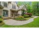 Inviting front porch and stone accents at 8170 Hurakan Creek Xing, Cumming, GA 30028