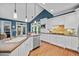 Modern kitchen with stainless steel appliances, light countertops, and an island with bar seating at 8170 Hurakan Creek Xing, Cumming, GA 30028