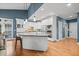 Contemporary kitchen with a center island, stainless appliances, and lots of natural light at 8170 Hurakan Creek Xing, Cumming, GA 30028