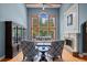 Bright living room with hardwood floors, large windows, and fireplace at 8170 Hurakan Creek Xing, Cumming, GA 30028