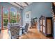 Bright living room with hardwood floors, fireplace, and high ceilings at 8170 Hurakan Creek Xing, Cumming, GA 30028