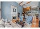 Bright living room with hardwood floors, fireplace, and high ceilings at 8170 Hurakan Creek Xing, Cumming, GA 30028