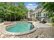 Backyard with a large swimming pool and spacious patio, perfect for relaxation and entertaining at 8170 Hurakan Creek Xing, Cumming, GA 30028