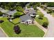 Aerial view of the home and landscaped front yard in a quiet neighborhood with mature trees at 892 Wayland Ct, Smyrna, GA 30080