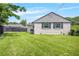 The home's expansive backyard features a well-maintained lawn and a view of the property's exterior at 892 Wayland Ct, Smyrna, GA 30080