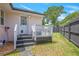Fenced backyard featuring a deck with a white railing and stairs with access to the back door at 892 Wayland Ct, Smyrna, GA 30080