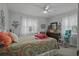 Cozy bedroom with a ceiling fan, bright walls, and two windows for natural light at 892 Wayland Ct, Smyrna, GA 30080