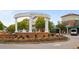 View of the Smyrna Market Village entrance with a fountain, brick walkways, and lush landscaping at 892 Wayland Ct, Smyrna, GA 30080