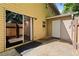 This backyard features a patio with a wooden fence, an outdoor storage closet, and sliding glass door access at 111 Northdale Pl, Lawrenceville, GA 30046