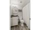Bathroom featuring wood-look flooring, a vessel sink, and a shower with curtain at 111 Northdale Pl, Lawrenceville, GA 30046