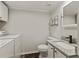 Updated bathroom with granite vanity, modern fixtures, and convenient laundry area at 111 Northdale Pl, Lawrenceville, GA 30046