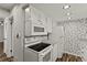 Charming kitchen featuring granite countertops and appliances in an efficient and updated space at 111 Northdale Pl, Lawrenceville, GA 30046
