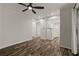 Living room with ceiling fan and view into the kitchen at 111 Northdale Pl, Lawrenceville, GA 30046