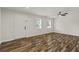 Bright living room featuring stylish flooring, modern ceiling fan, and neutral paint at 111 Northdale Pl, Lawrenceville, GA 30046