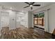 Bright living room with wood floors and sliding glass doors to the patio at 111 Northdale Pl, Lawrenceville, GA 30046