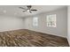Bright living room featuring stylish flooring, modern ceiling fan, and neutral paint at 111 Northdale Pl, Lawrenceville, GA 30046