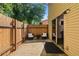 Cozy outdoor patio features a privacy fence, seating, and a sliding door entry to the home at 111 Northdale Pl, Lawrenceville, GA 30046