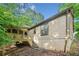 Back of home showing the deck with steps leading to the backyard at 162 Riverchase Dr, Woodstock, GA 30188