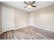 This bedroom has two closets, light colored walls, and wood-look vinyl flooring at 162 Riverchase Dr, Woodstock, GA 30188