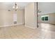 Bright dining area with tile flooring, blending with other spaces, offering a versatile layout at 162 Riverchase Dr, Woodstock, GA 30188