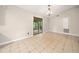 Dining area with tile flooring and a sliding door to the deck, ideal for indoor-outdoor entertaining at 162 Riverchase Dr, Woodstock, GA 30188