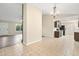 Open concept dining area with tile floors, chandelier, and seamless flow to the living spaces at 162 Riverchase Dr, Woodstock, GA 30188