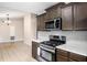 Bright kitchen featuring stainless steel appliances and sleek countertops at 162 Riverchase Dr, Woodstock, GA 30188
