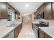Traditional kitchen featuring stainless steel appliances, tile flooring, and sleek countertops at 162 Riverchase Dr, Woodstock, GA 30188