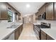 Open kitchen with a bright window, stainless appliances, and view into dining area at 162 Riverchase Dr, Woodstock, GA 30188