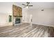 Spacious living room with new flooring, a stone fireplace, and an open layout for entertaining at 162 Riverchase Dr, Woodstock, GA 30188