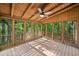 Screened-in porch with wood ceiling, railings, and view of nature at 162 Riverchase Dr, Woodstock, GA 30188