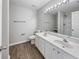 Bathroom with dual sinks, modern vanity, and updated light fixtures at 2628 Downingwood Ln, Grayson, GA 30017