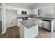 Modern kitchen with an island, stainless steel appliances, and granite countertops at 2628 Downingwood Ln, Grayson, GA 30017